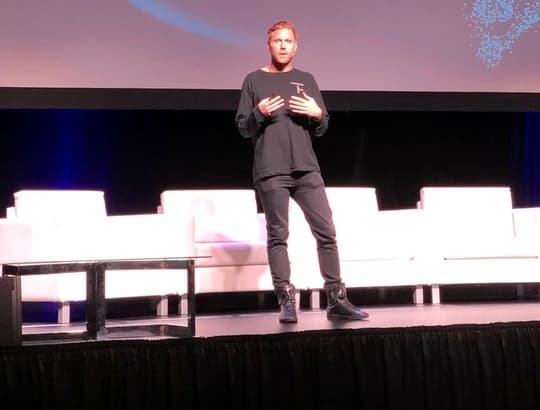 Harrison Hines speaking on stage